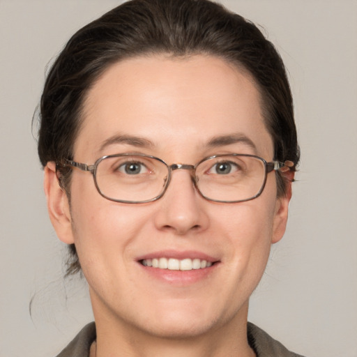 Joyful white young-adult female with short  brown hair and grey eyes