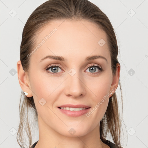 Joyful white young-adult female with long  brown hair and blue eyes