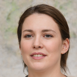 Joyful white young-adult female with medium  brown hair and green eyes