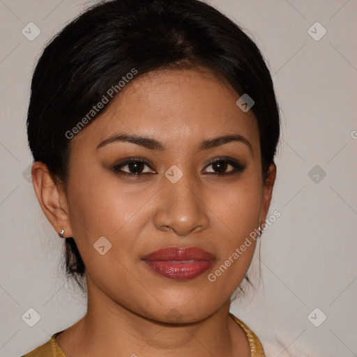 Joyful latino young-adult female with medium  brown hair and brown eyes