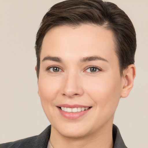 Joyful white young-adult female with short  brown hair and brown eyes