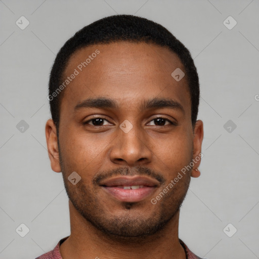 Joyful black young-adult male with short  brown hair and brown eyes