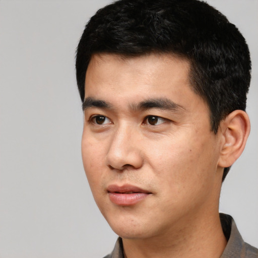 Neutral white young-adult male with short  black hair and brown eyes