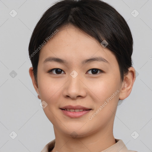 Joyful asian young-adult female with short  brown hair and brown eyes