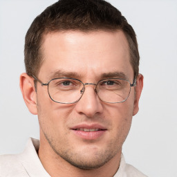 Joyful white adult male with short  brown hair and grey eyes