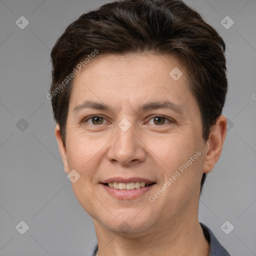 Joyful white adult female with short  brown hair and brown eyes