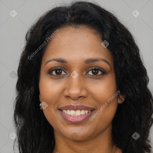 Joyful black young-adult female with long  brown hair and brown eyes