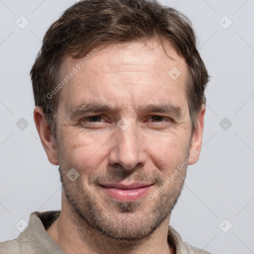 Joyful white adult male with short  brown hair and grey eyes