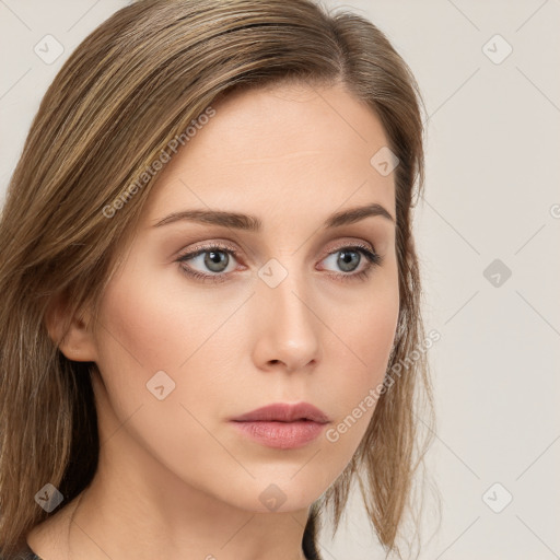 Neutral white young-adult female with long  brown hair and green eyes