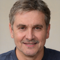 Joyful white middle-aged male with short  brown hair and brown eyes