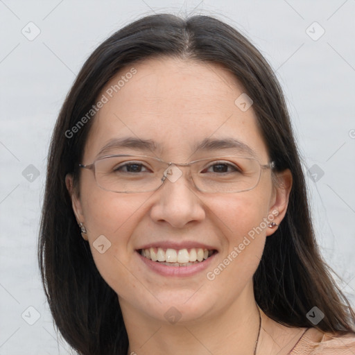 Joyful white adult female with long  brown hair and brown eyes