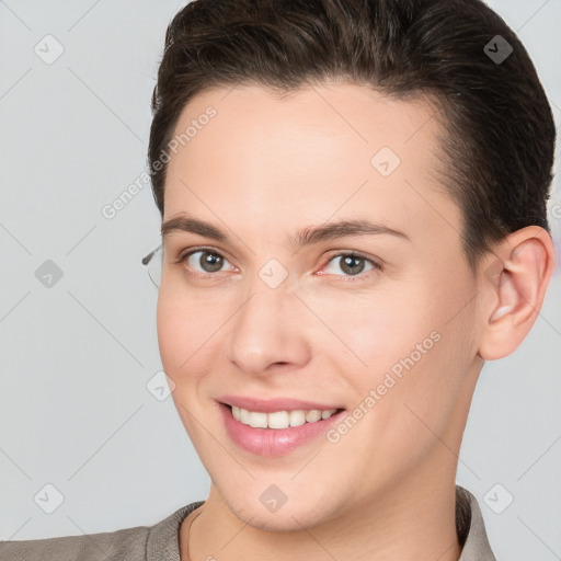 Joyful white young-adult female with short  brown hair and brown eyes