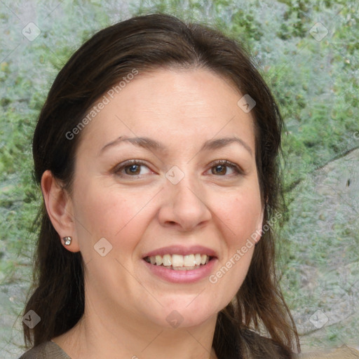 Joyful white adult female with medium  brown hair and brown eyes