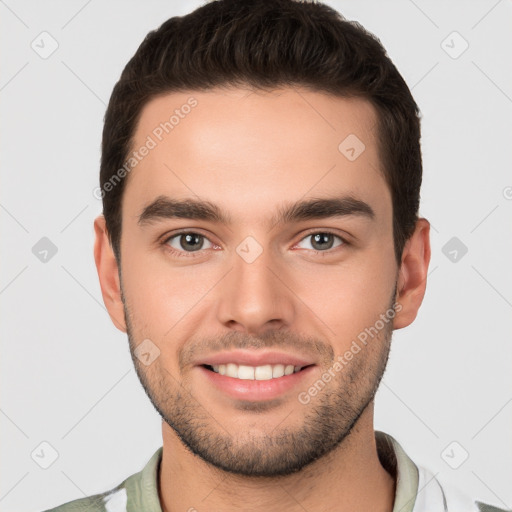 Joyful white young-adult male with short  brown hair and brown eyes