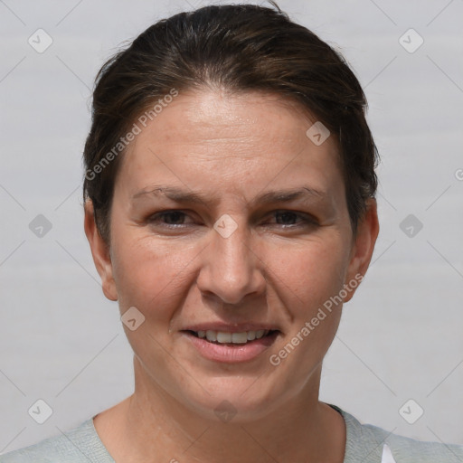 Joyful white adult female with short  brown hair and brown eyes