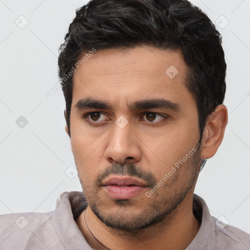 Neutral latino young-adult male with short  black hair and brown eyes