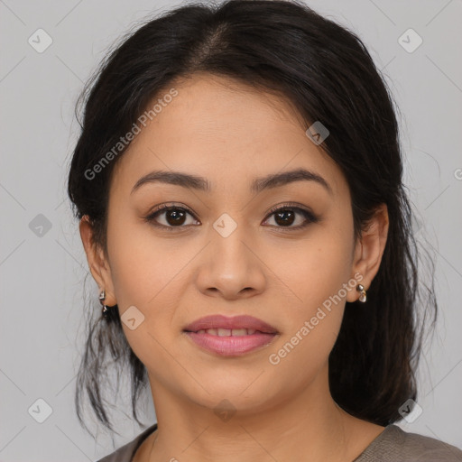 Joyful latino young-adult female with medium  brown hair and brown eyes