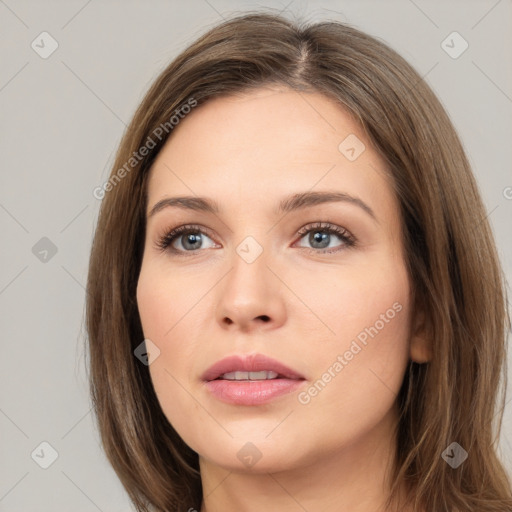 Neutral white young-adult female with long  brown hair and brown eyes