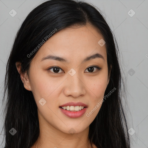 Joyful asian young-adult female with long  brown hair and brown eyes