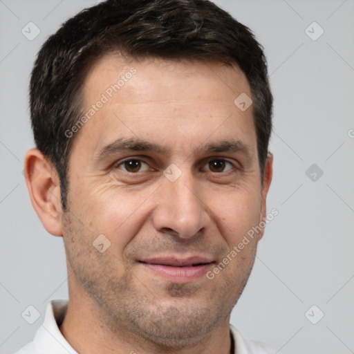 Joyful white adult male with short  brown hair and brown eyes