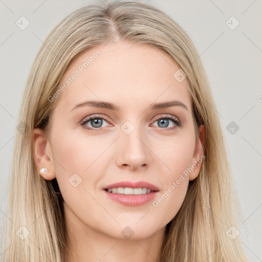 Joyful white young-adult female with long  brown hair and blue eyes