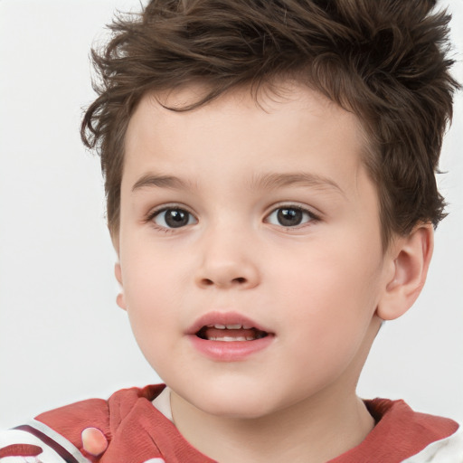 Joyful white child male with short  brown hair and brown eyes