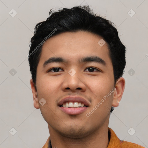 Joyful asian young-adult male with short  black hair and brown eyes
