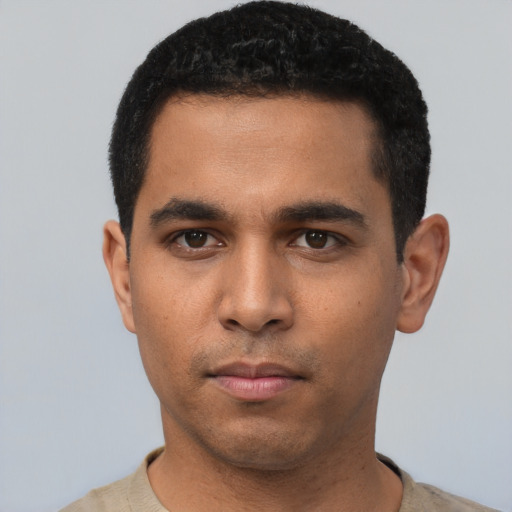 Neutral latino young-adult male with short  black hair and brown eyes