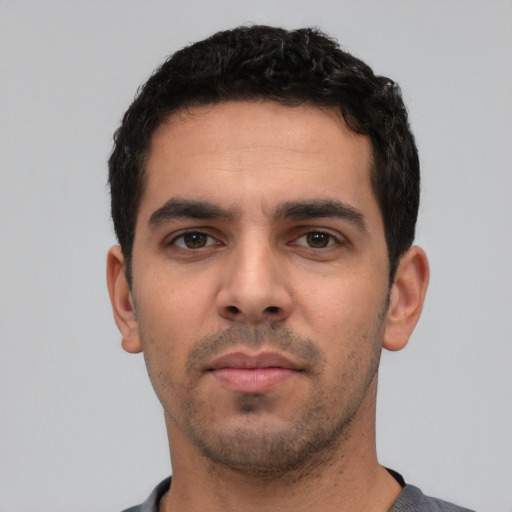Neutral white young-adult male with short  black hair and brown eyes