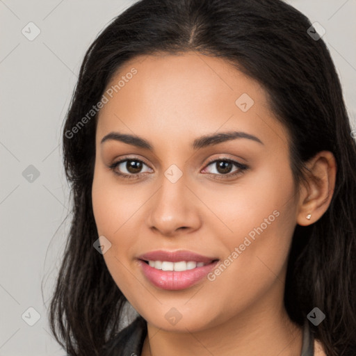 Joyful latino young-adult female with long  brown hair and brown eyes