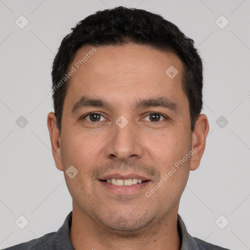 Joyful white young-adult male with short  black hair and brown eyes