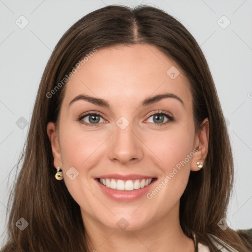 Joyful white young-adult female with long  brown hair and grey eyes