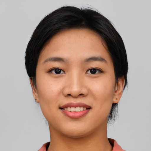 Joyful asian young-adult female with short  black hair and brown eyes