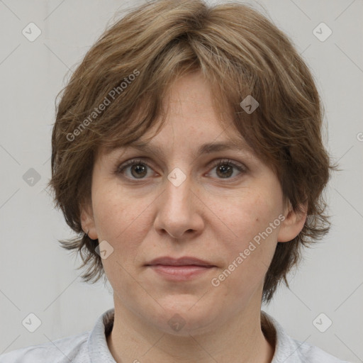 Joyful white adult female with medium  brown hair and grey eyes