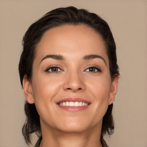 Joyful white young-adult female with medium  brown hair and brown eyes