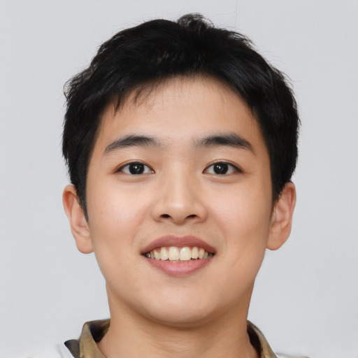 Joyful asian young-adult male with short  black hair and brown eyes