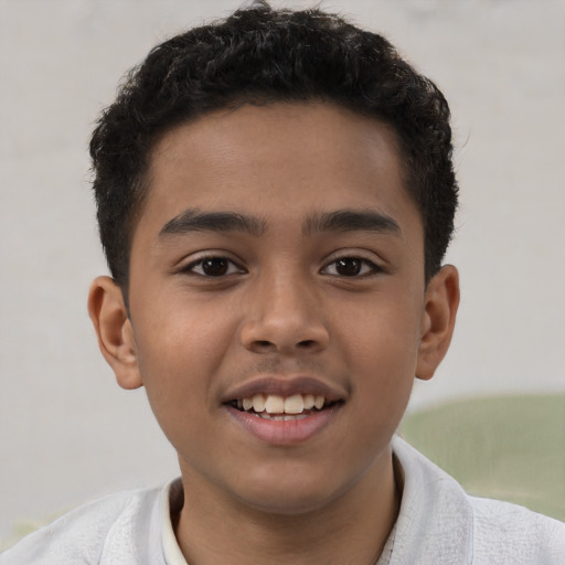 Joyful latino child male with short  brown hair and brown eyes