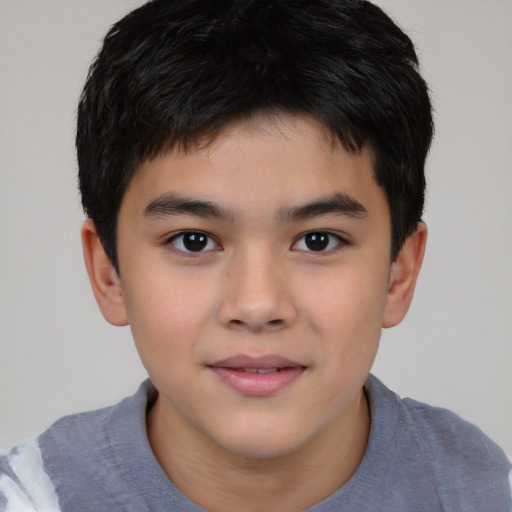 Joyful white child male with short  brown hair and brown eyes