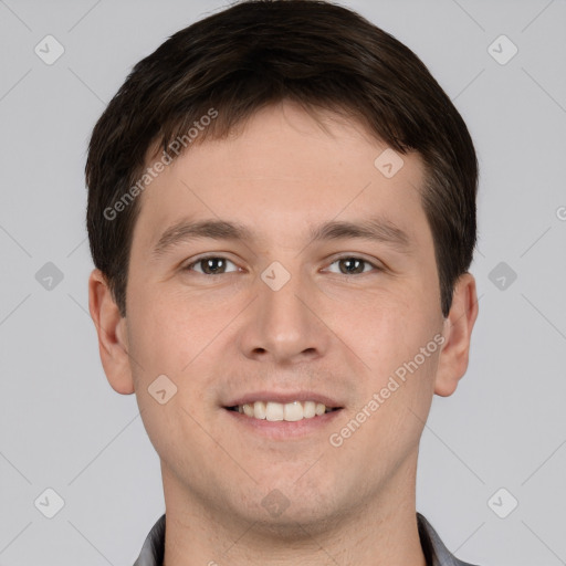 Joyful white young-adult male with short  brown hair and brown eyes