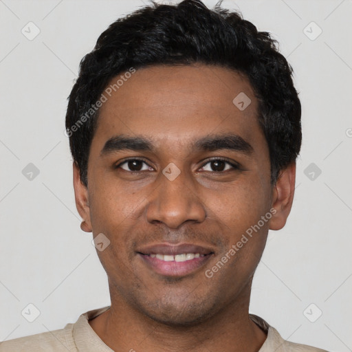 Joyful black young-adult male with short  black hair and brown eyes