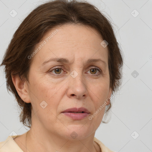 Joyful white adult female with medium  brown hair and brown eyes