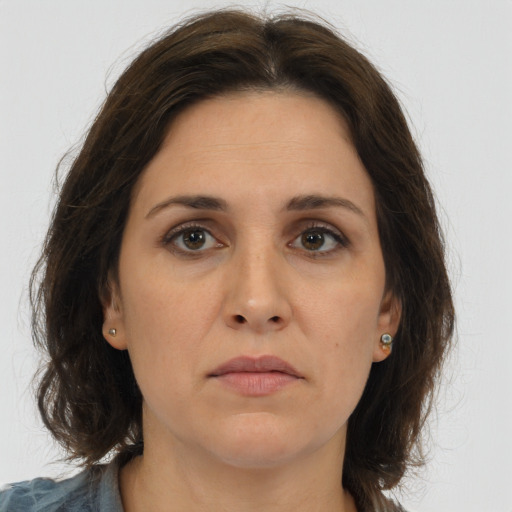 Neutral white adult female with long  brown hair and brown eyes