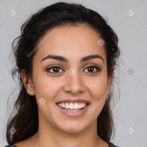 Joyful latino young-adult female with medium  brown hair and brown eyes