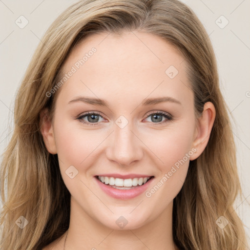 Joyful white young-adult female with long  brown hair and blue eyes