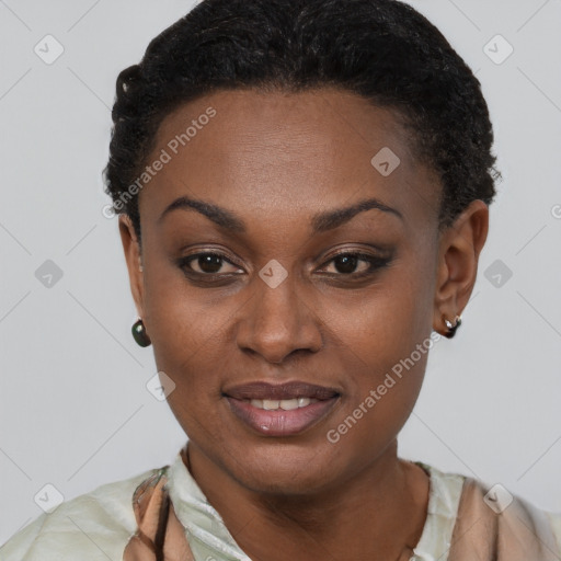 Joyful black young-adult female with short  black hair and brown eyes