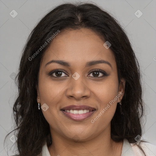 Joyful black young-adult female with long  brown hair and brown eyes