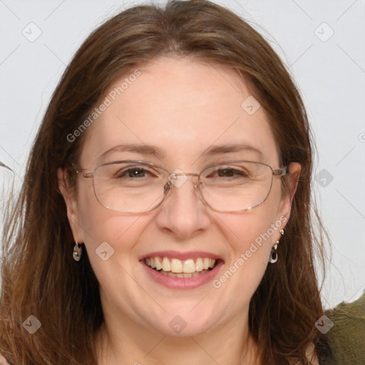 Joyful white adult female with long  brown hair and grey eyes