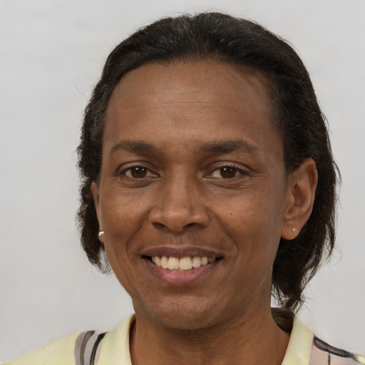 Joyful latino adult female with short  brown hair and brown eyes