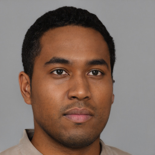 Neutral black young-adult male with short  black hair and brown eyes