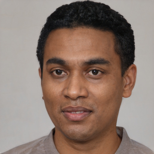 Neutral black young-adult male with short  black hair and brown eyes